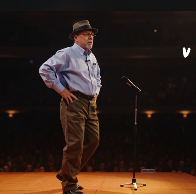R. Dale Brunet speaking on stage